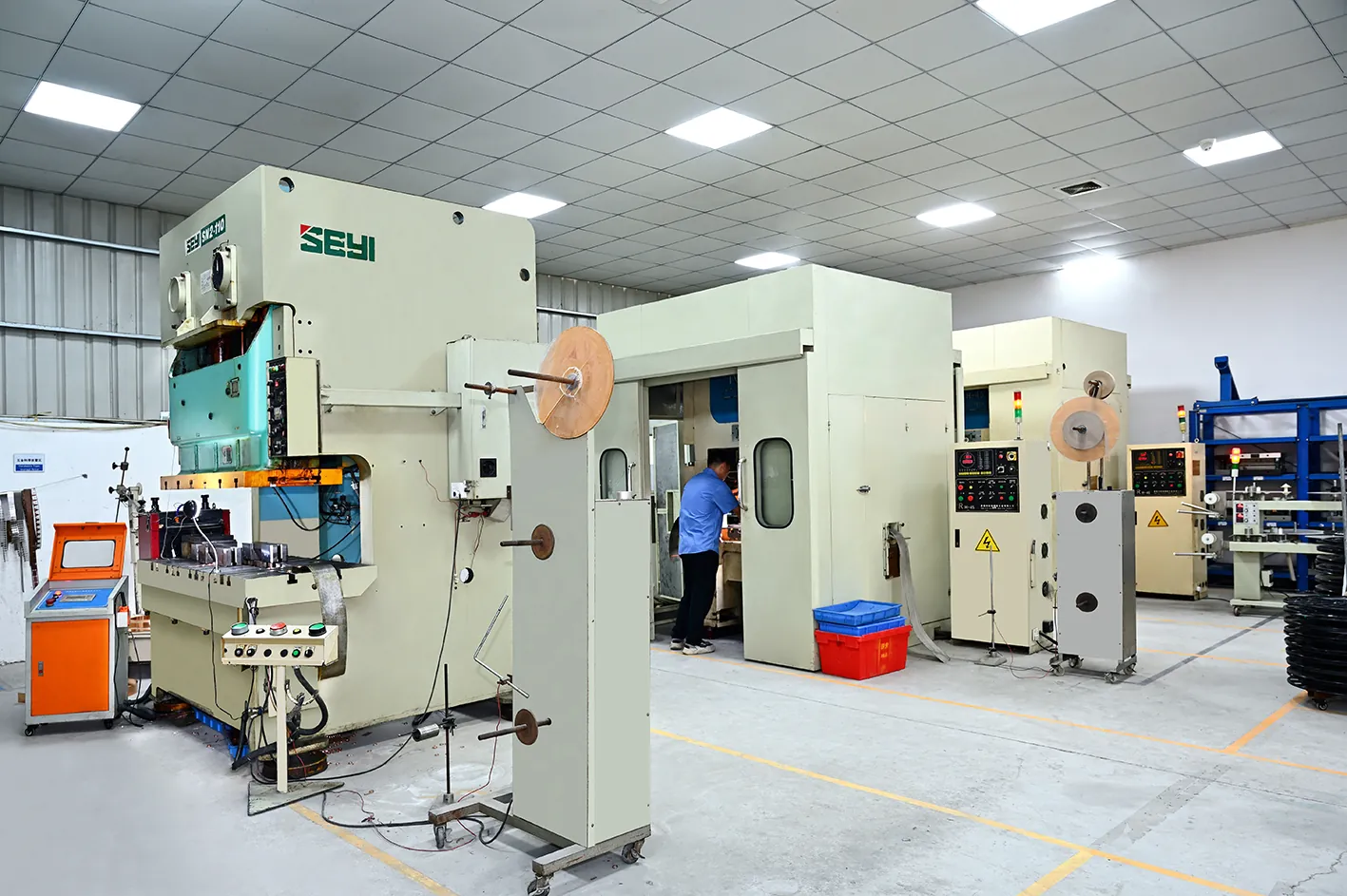 High-speed gantry press running a 24-station progressive die for precision terminal stamping